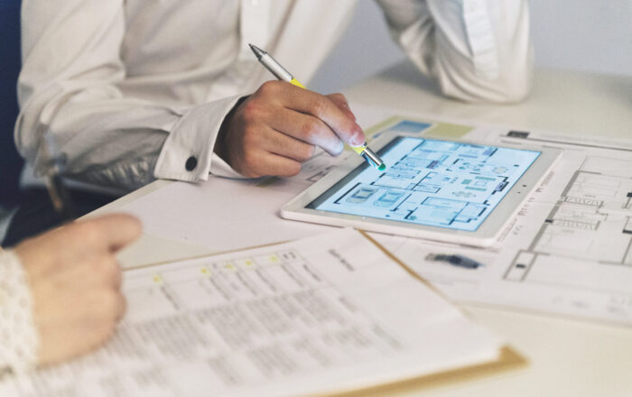 crop-people-working-with-plans-tablet