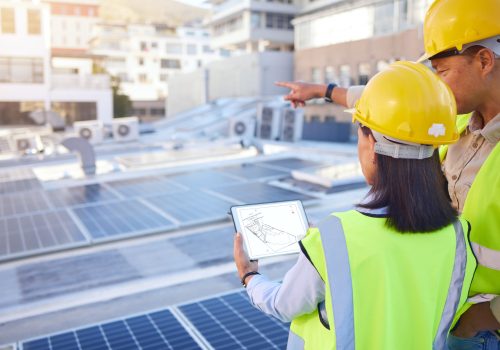 Engineer, back or woman with man, solar energy or sustainable power inspection. Technician, male or female for panels maintenance, eco friendly construction or agriculture for alternative electricity.